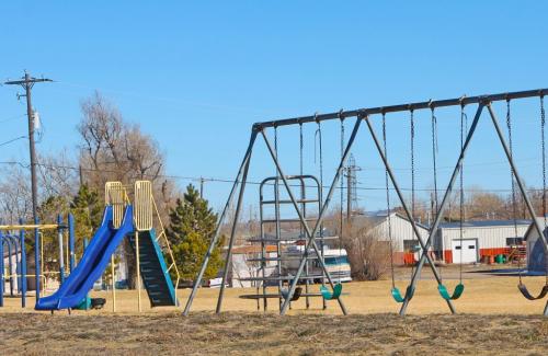 Playground with blue slide and swing set