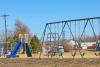 Playground with blue slide and swing set